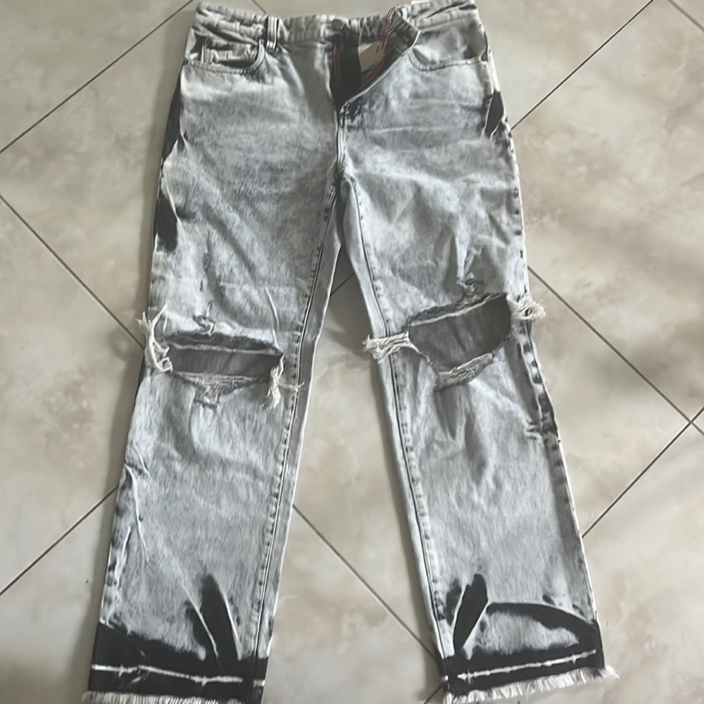 NWT Alice and Olivia jeans size 32.  Black and white acid wash with ripped knees